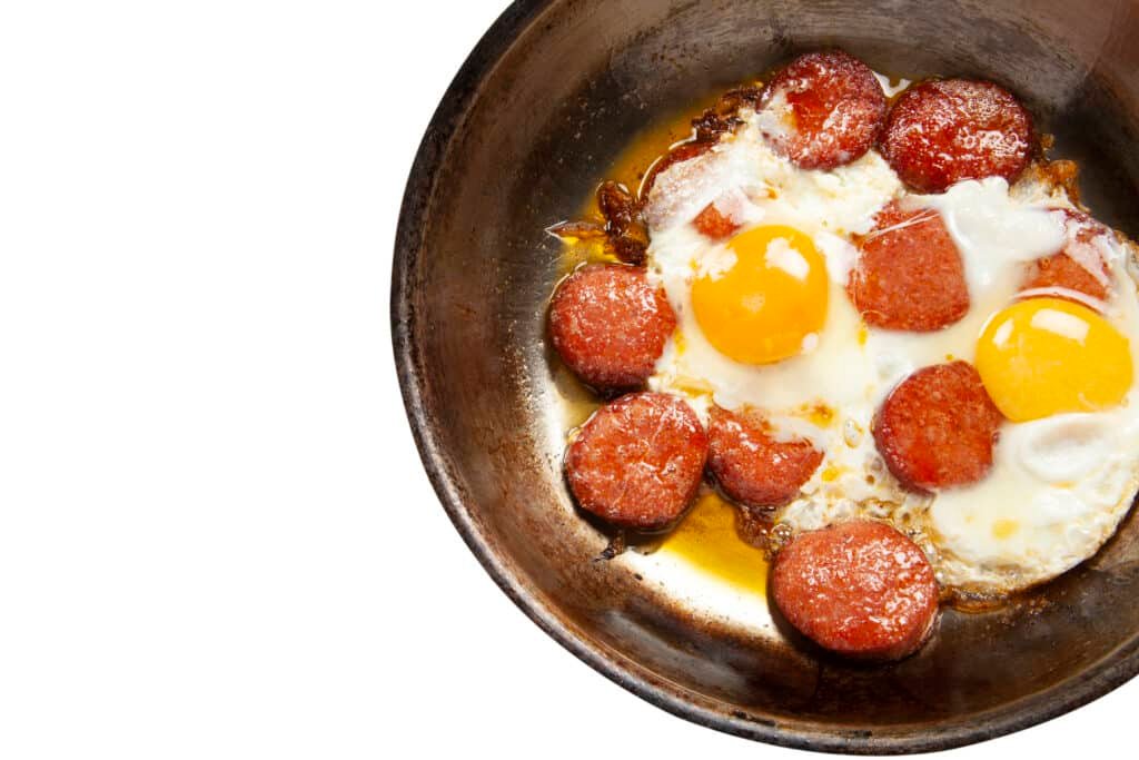 copper pan with fried egg and sausage 2023 02 16 01 37 43 utc